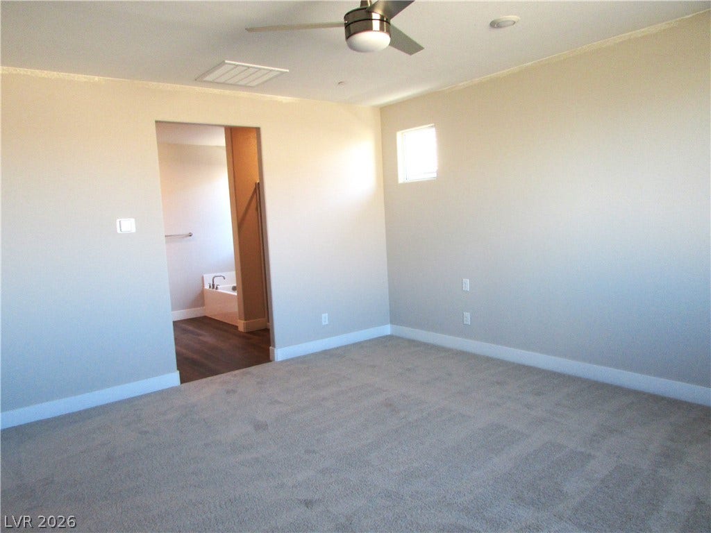 988 Gentle Swan, Henderson, NV 89011 A spacious, naturally illuminated bedroom offers direct access to a well-appointed private bath.