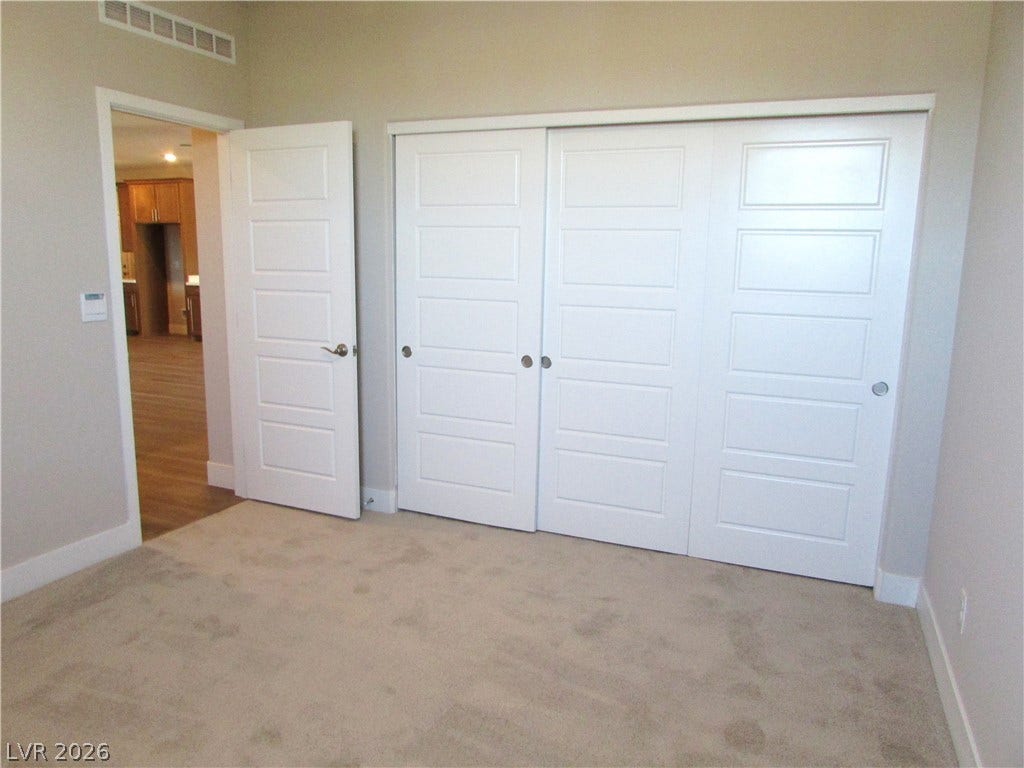 988 Gentle Swan, Henderson, NV 89011 Ample closet space complements soft carpeting and a clear passageway to an adjacent living area.
