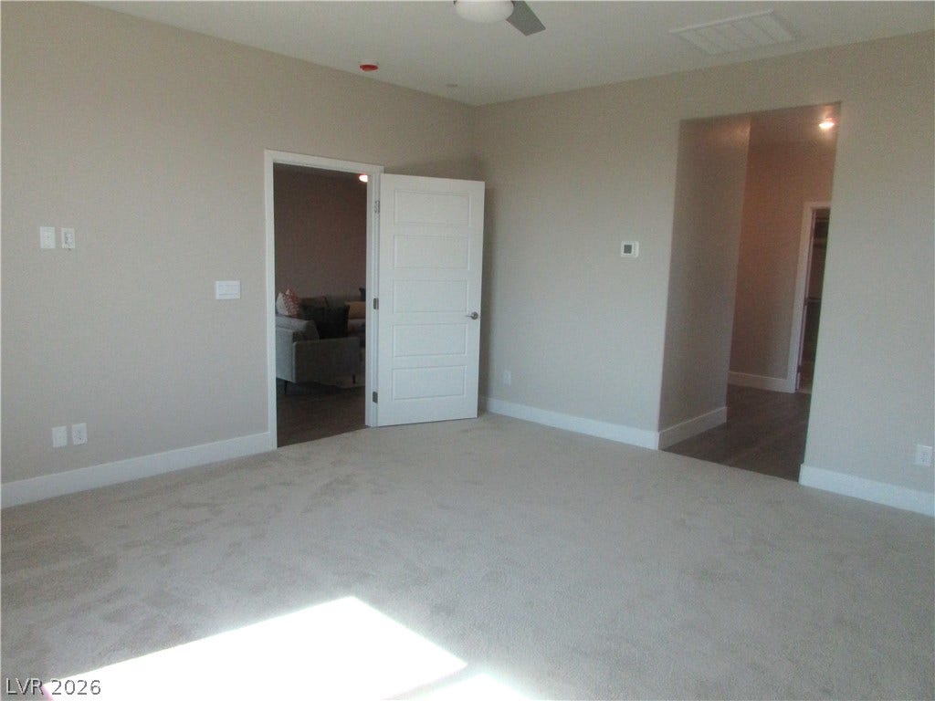 988 Gentle Swan, Henderson, NV 89011 Sun-drenched, carpeted interior space offers versatile living arrangements. Photo is of actual home.