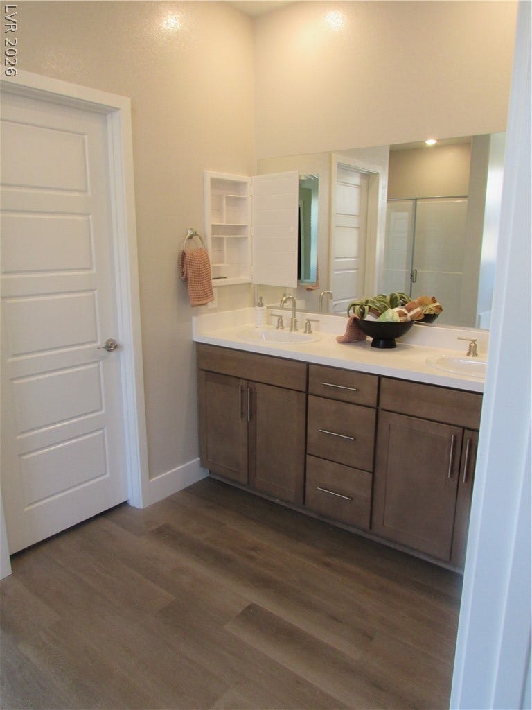 988 Gentle Swan, Henderson, NV 89011 Dual vanity sinks provide ample space in this well-appointed bathroom. Photo is of actual home.