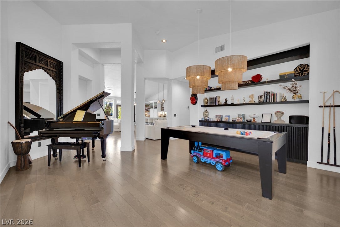 2516 Serenity Hollow Drive, Henderson, NV 89052 Elegant hardwood flooring sets the stage for grand entertaining and lively recreation.
