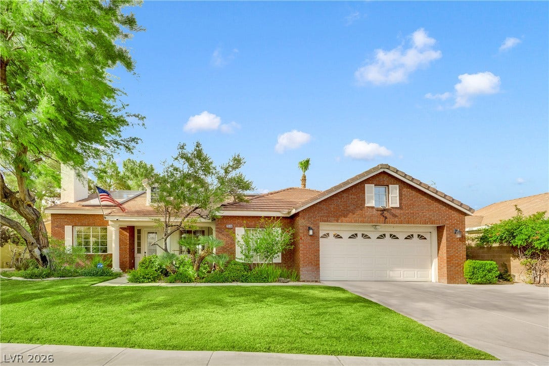 2516 Serenity Hollow Drive, Henderson, NV 89052 Inviting Curb Appeal & Classic Brick Exterior