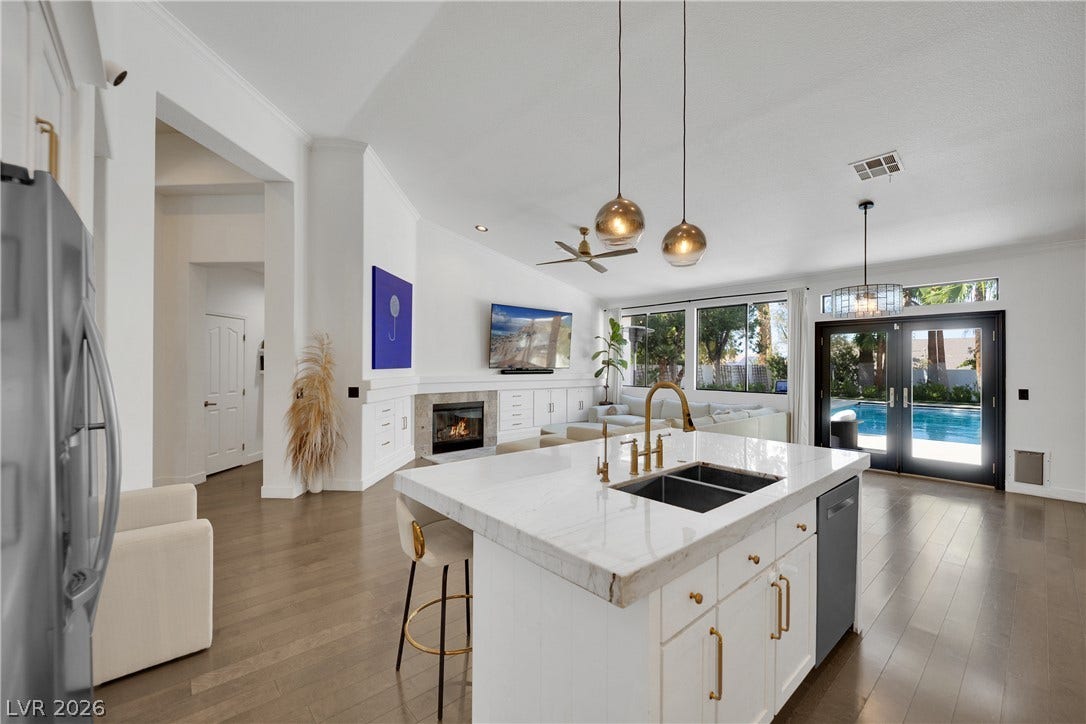 2516 Serenity Hollow Drive, Henderson, NV 89052 Kitchen Island with a gold faucet sets the tone for elegant entertaining with a POOL view.