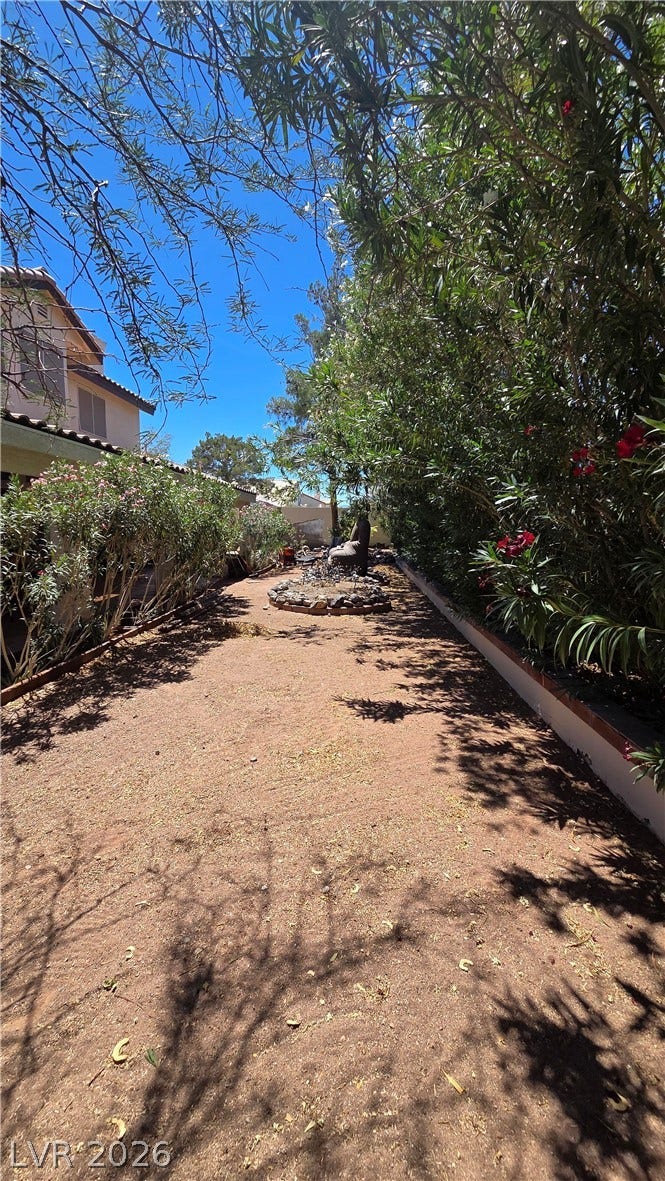 884 E Robindale Road, Las Vegas, NV 89123 A private yard with ample space and mature landscaping.