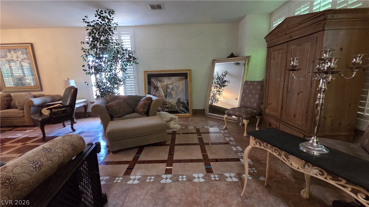 884 E Robindale Road, Las Vegas, NV 89123 Ornate tiled flooring adds character to this generously sized living room.