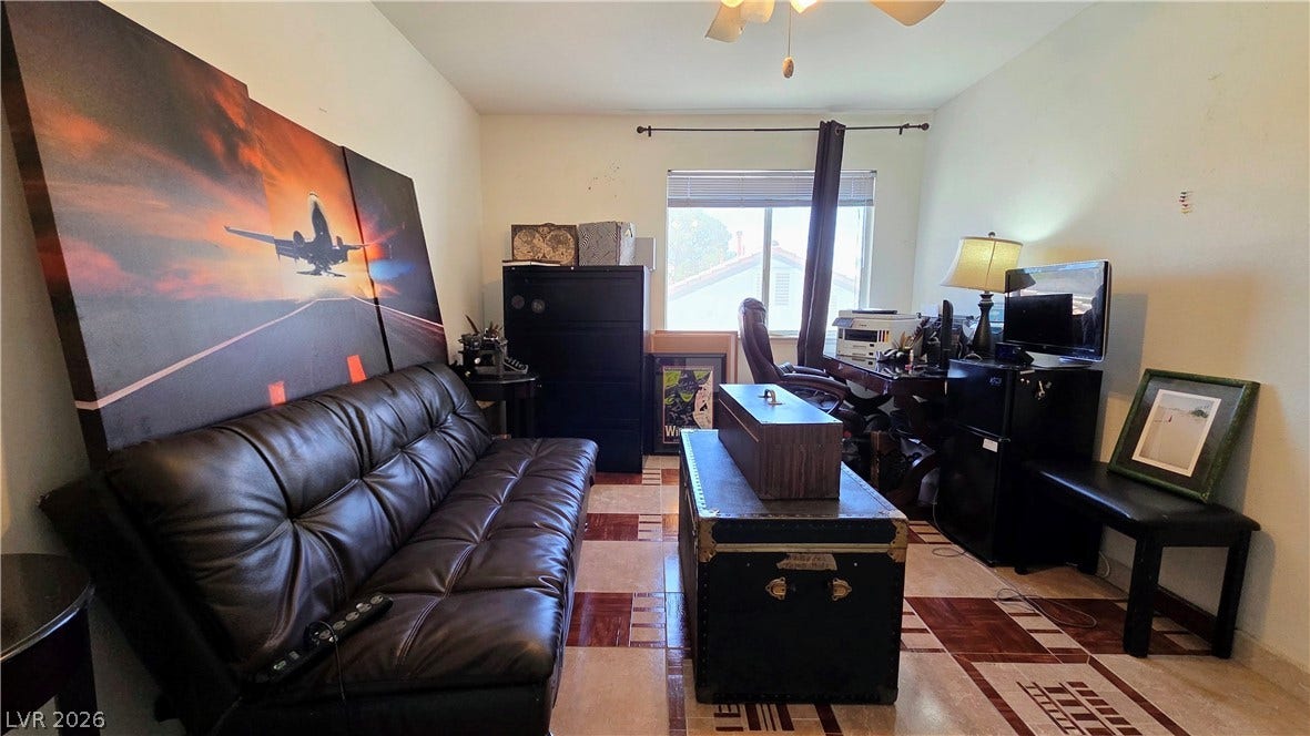 884 E Robindale Road, Las Vegas, NV 89123 Functional living space with varied flooring, ideal for a flexible arrangement.