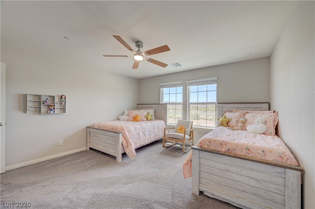 3rd bed, A comforting bedroom features plush carpet and a stylish ceiling fan for year-round comfort.