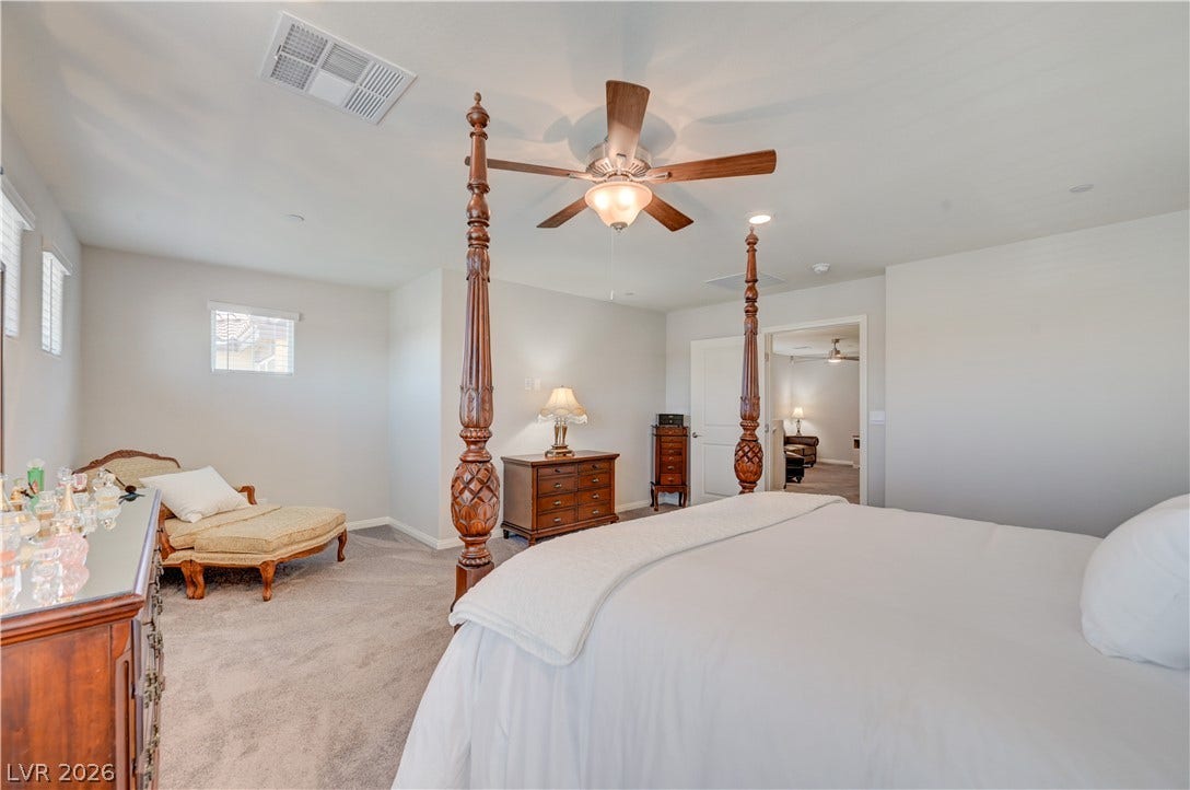 Relax in this tranquil bedroom with retreat, ceiling fan & light