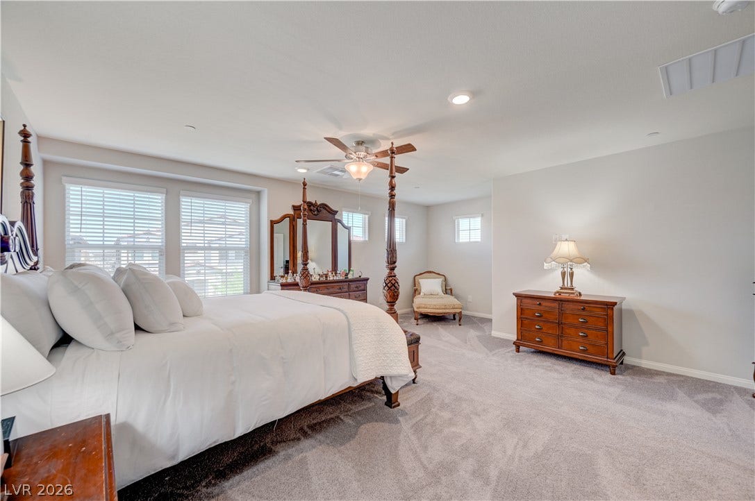 Relax in this tranquil bedroom with retreat, ceiling fan & light