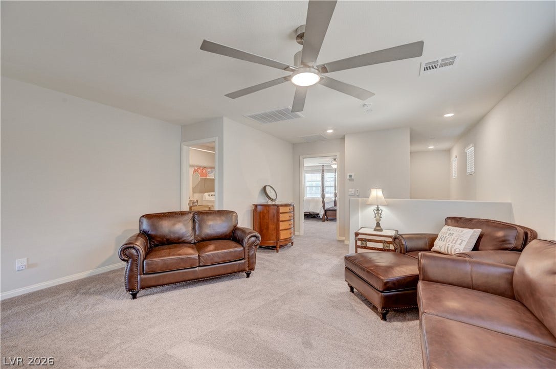 An inviting versatile loft could be secondary living space with ceiling fan & light adds to the homes appeal, providing an ideal area for relaxation or play.