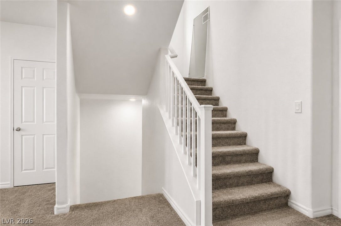 A well-lit staircase provides seamless flow between levels.