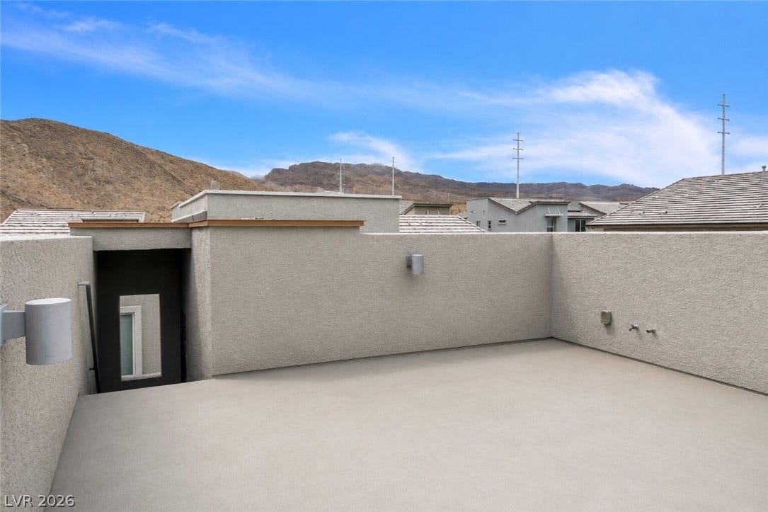 A spacious rooftop deck provides a private outdoor retreat with scenic mountain vistas.