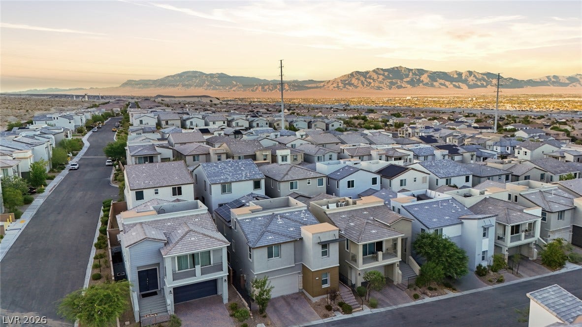 Nestled near towering desert peaks, this modern neighborhood exhibits striking contemporary architecture.