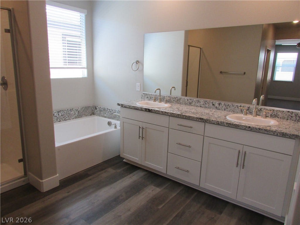 510 CHESTNUT FALCON AVE, Henderson, NV 89011 Granite counters and dual sinks provide ample space in this well-appointed bathroom.