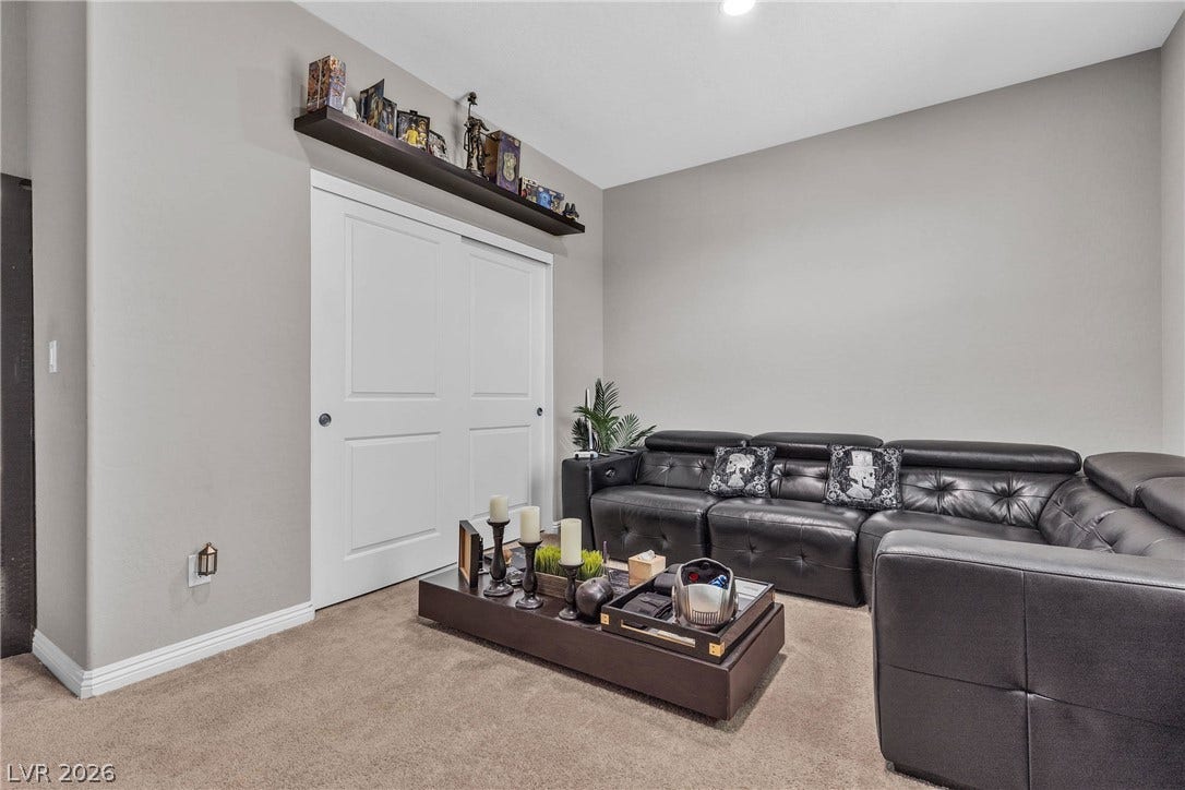 3106 Berceto Court, Henderson, NV 89044 Comfortable seating and practical storage define this inviting casual living area.