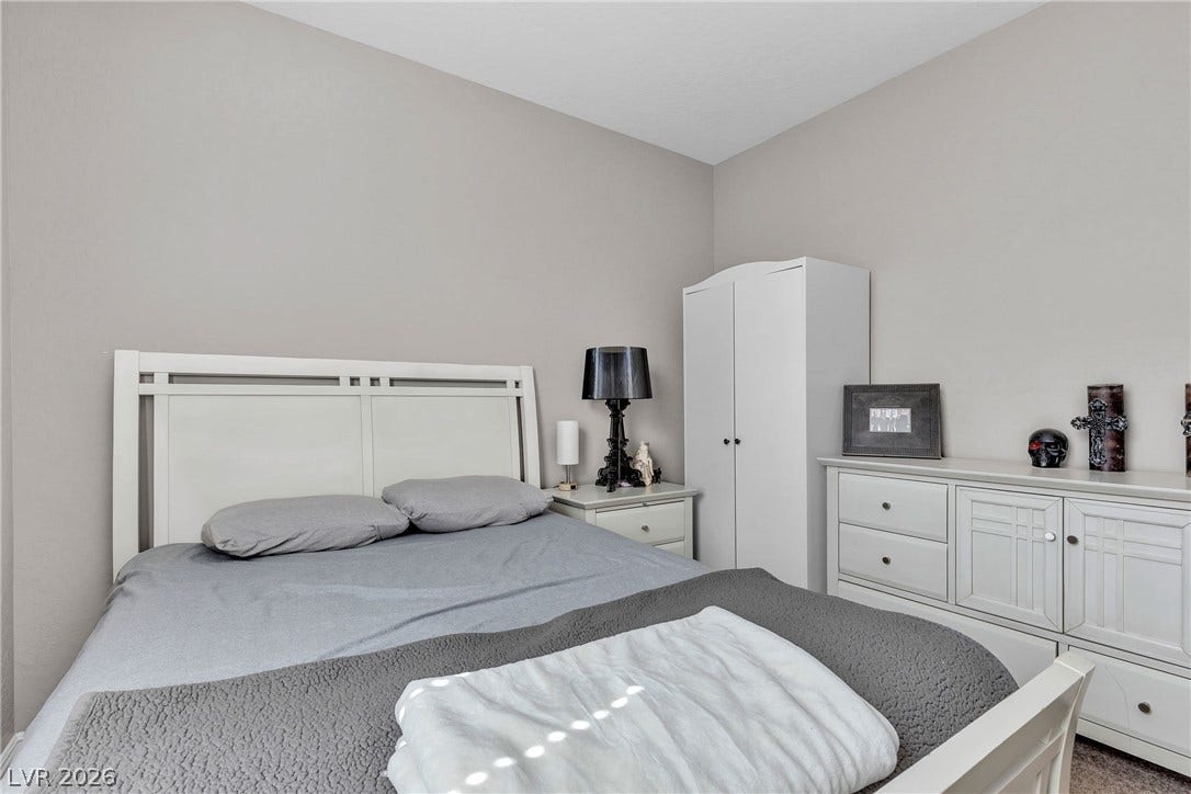 3106 Berceto Court, Henderson, NV 89044 This naturally illuminated bedroom offers ample space and a neutral color palette, ready for personalization.