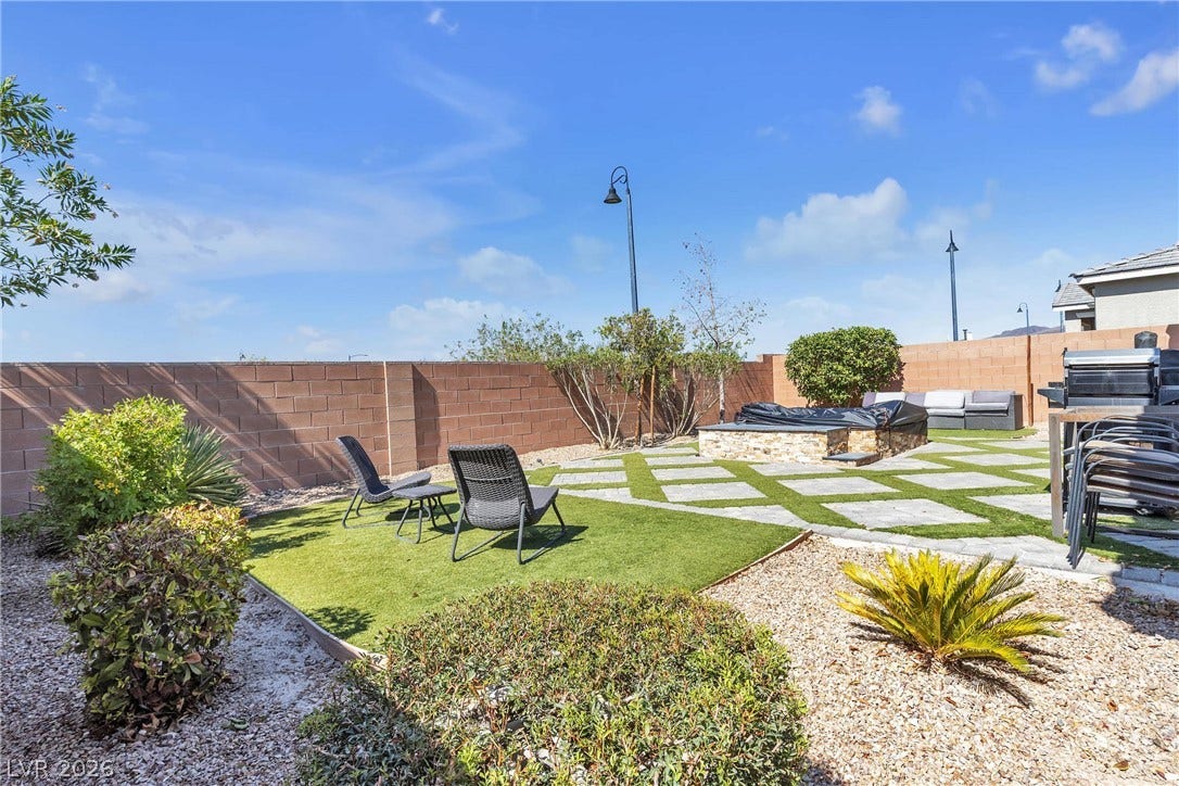 3106 Berceto Court, Henderson, NV 89044 A private yard with a fire pit offers a serene outdoor escape.