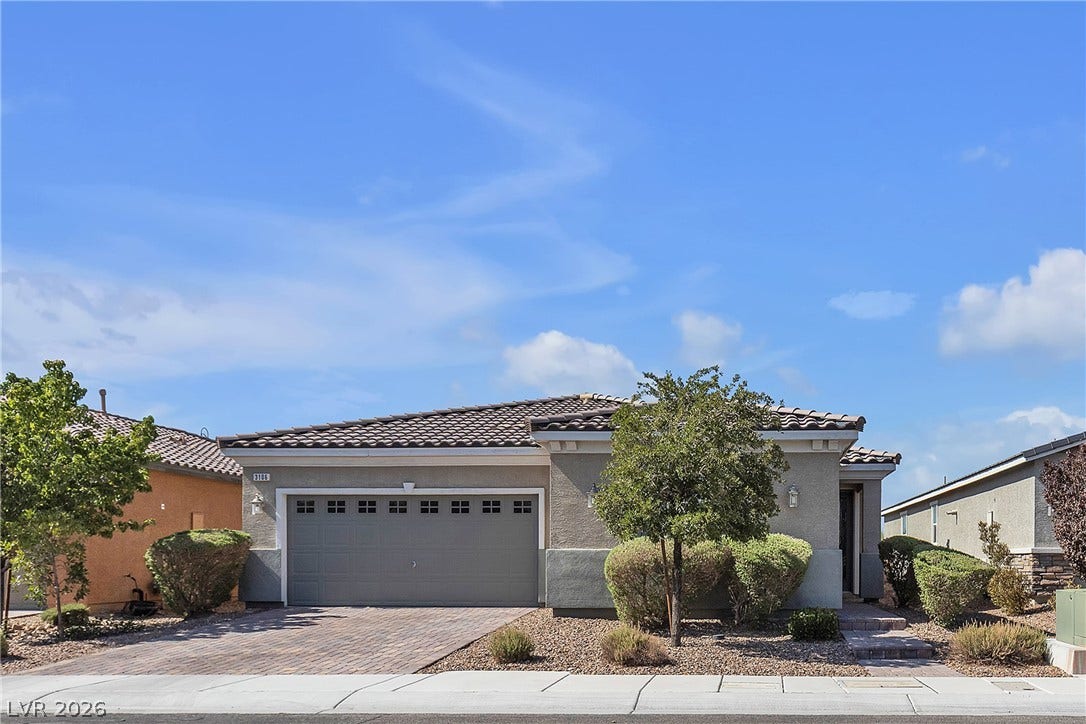3106 Berceto Court, Henderson, NV 89044 A classic tiled roof and well-maintained landscaping define this inviting curb appeal.