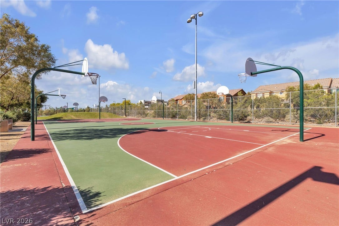 3106 Berceto Court, Henderson, NV 89044 Enjoy outdoor recreation with this vibrant, multi-court basketball facility, offering ample space for active living.