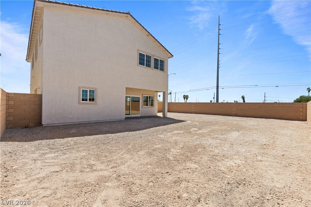 2405 Copperbelt Street, Las Vegas, NV 89030 A spacious backyard awaits personalization with ample room for outdoor living enhancements.