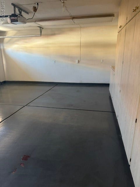 1851 Hillpointe Road, #1412, Henderson, NV 89074 Ample space with durable flooring and automated access define this functional garage.