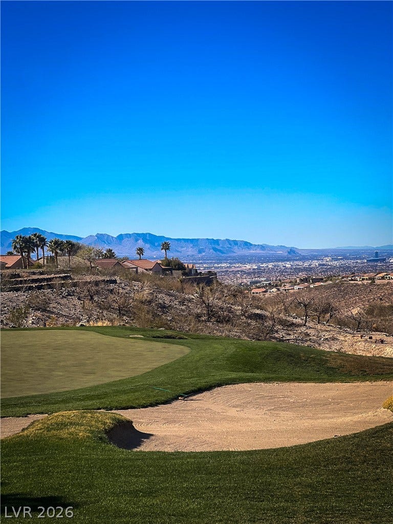 2157 Sawtooth Mountain Drive, Henderson, NV 89044 The golf course offers commanding views of the distant city and surrounding mountains.
