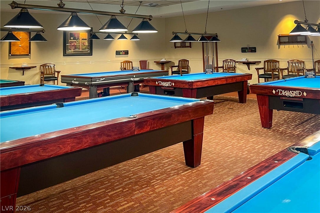2157 Sawtooth Mountain Drive, Henderson, NV 89044 A vibrant game room with multiple pool tables provides endless entertainment for residents.