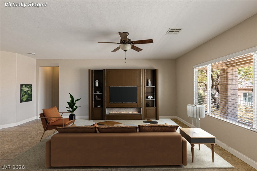 2157 Sawtooth Mountain Drive, Henderson, NV 89044 A well-lit gathering space with ample large windows and natural light.