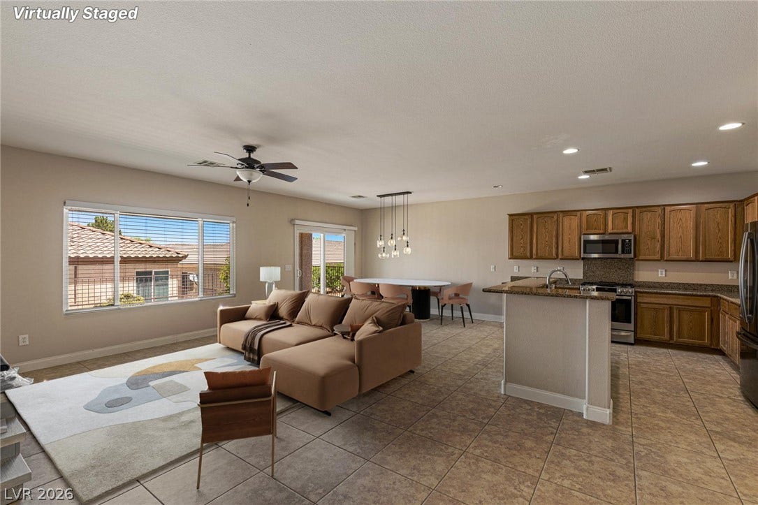 2157 Sawtooth Mountain Drive, Henderson, NV 89044 An open floorplan seamlessly connects the living area to the kitchen and dining space.