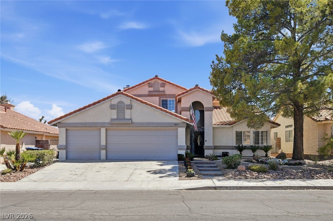 1827 Escondido Terrace, Henderson, NV 89074 A well-kept residence with a two-car garage and manicured desert landscaping.