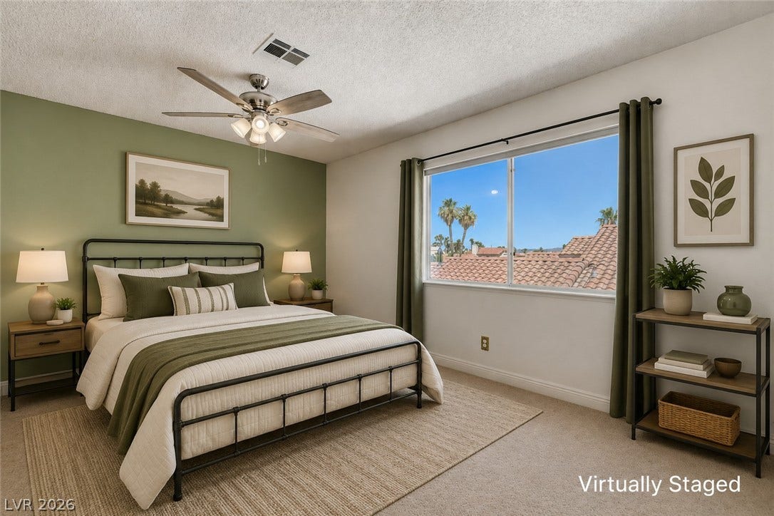 1827 Escondido Terrace, Henderson, NV 89074 Restful retreat with scenic views from the wide window and a comforting ceiling fan.