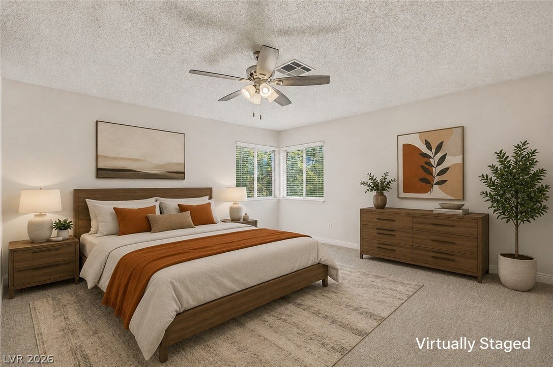 1827 Escondido Terrace, Henderson, NV 89074 Well-lit primary bedroom offers comfort and abundant natural illumination through corner windows.