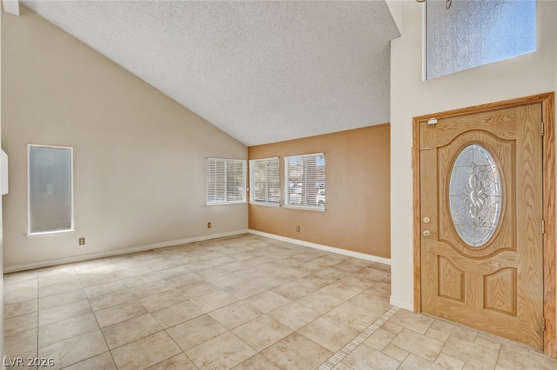 1827 Escondido Terrace, Henderson, NV 89074 A welcoming entryway with soaring vaulted ceilings and durable tile flooring.