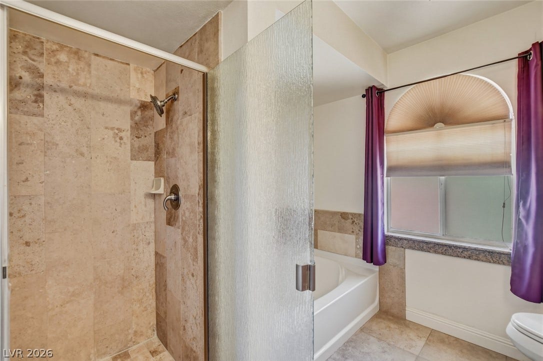 1827 Escondido Terrace, Henderson, NV 89074 Marble-tiled shower and separate soaking tub provide a spa-like retreat.
