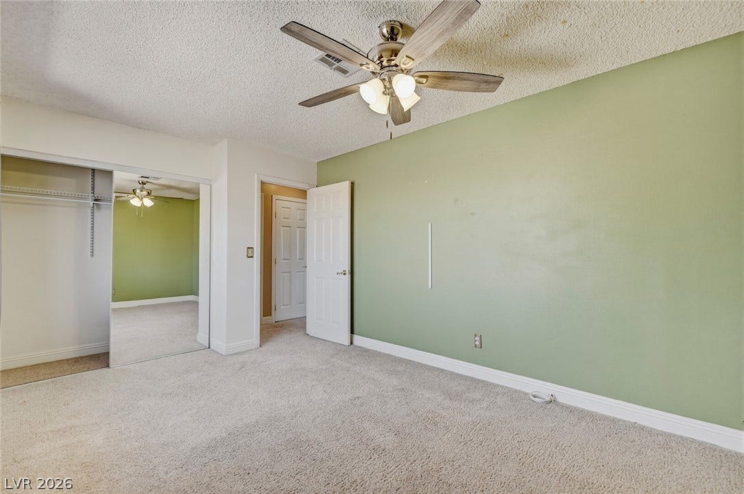 1827 Escondido Terrace, Henderson, NV 89074 A restful retreat with carpeted floors and a ceiling fan for year-round comfort.