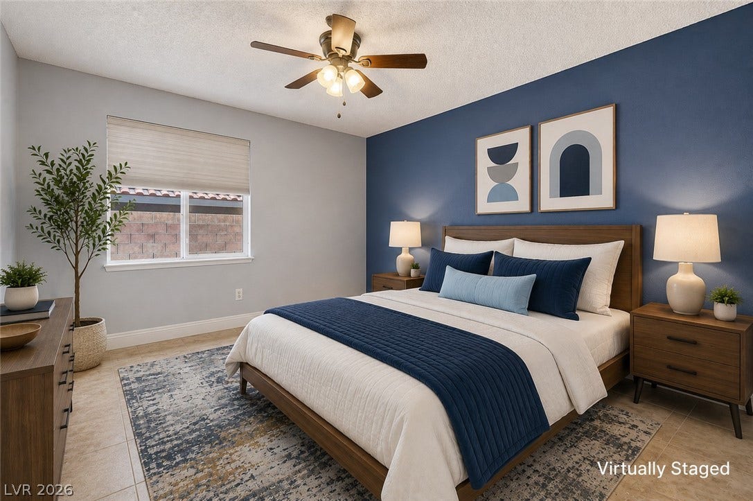 1827 Escondido Terrace, Henderson, NV 89074 A comforting retreat, this bedroom offers ample space and a stylish ceiling fan for year-round comfort.