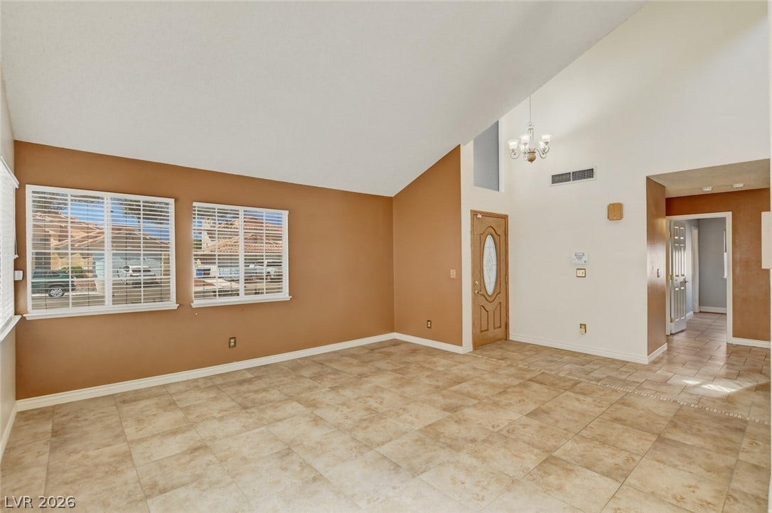 1827 Escondido Terrace, Henderson, NV 89074 Vast vaulted ceilings complement the tiled flooring in this generous living space.