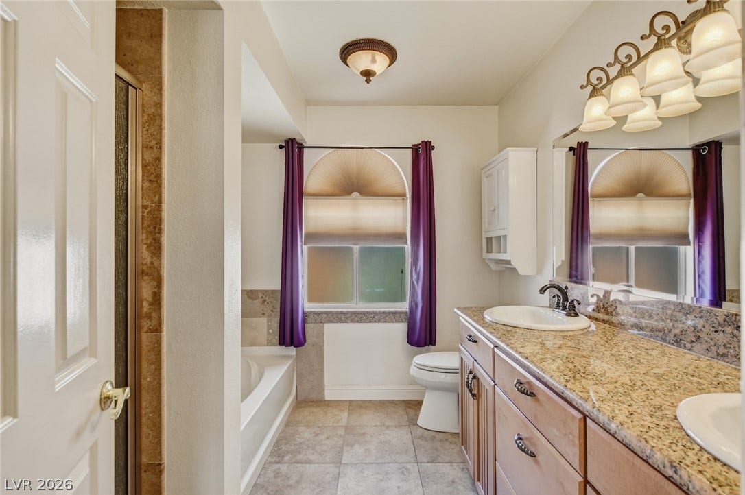 1827 Escondido Terrace, Henderson, NV 89074 Granite counters and tiled flooring provide an elegant, easy-care space.