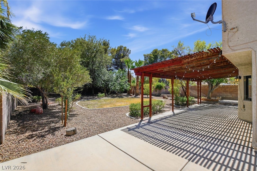 1827 Escondido Terrace, Henderson, NV 89074 A private yard with a covered patio offers ample space for outdoor relaxation and entertaining.