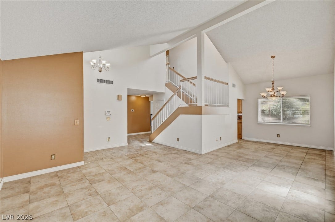1827 Escondido Terrace, Henderson, NV 89074 Lofty ceilings and durable tile flooring define this spacious living area.