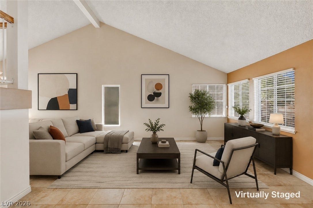 1827 Escondido Terrace, Henderson, NV 89074 Lofty vaulted ceilings elevate this open-concept living space with ample natural light.