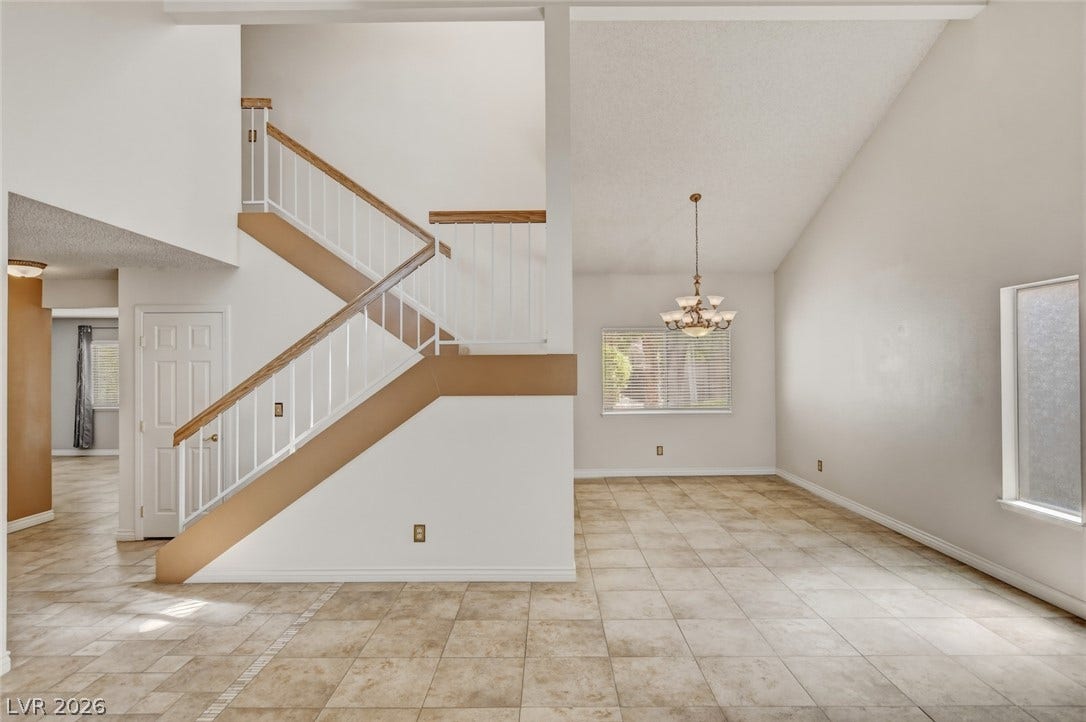 1827 Escondido Terrace, Henderson, NV 89074 A spacious entry area with soaring ceilings and a sweeping staircase.