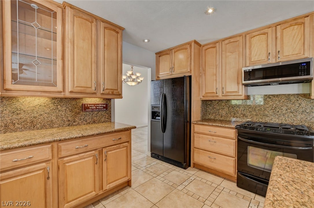 1827 Escondido Terrace, Henderson, NV 89074 Functional kitchen with ample cabinet space, durable countertops, and convenient modern appliances.