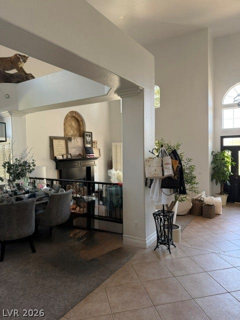 699 Brandy Hill Place, Henderson, NV 89052 An inviting entry foyer and adjoining living area with a fireplace offer a seamless flow for comfortable living.