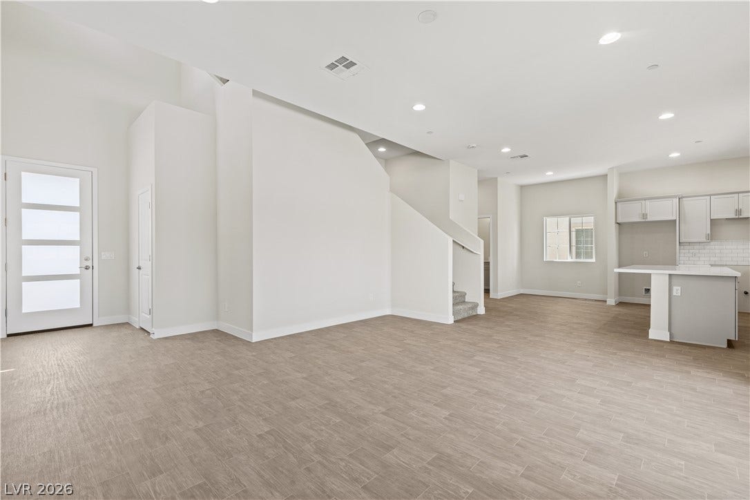 Clean lines and a spacious open floorplan define this inviting entry and living space.
