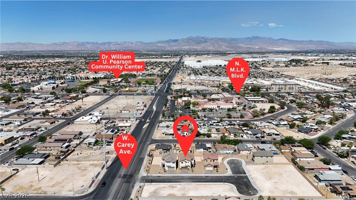 Panoramic mountain and neighborhood views frame this centrally located property.