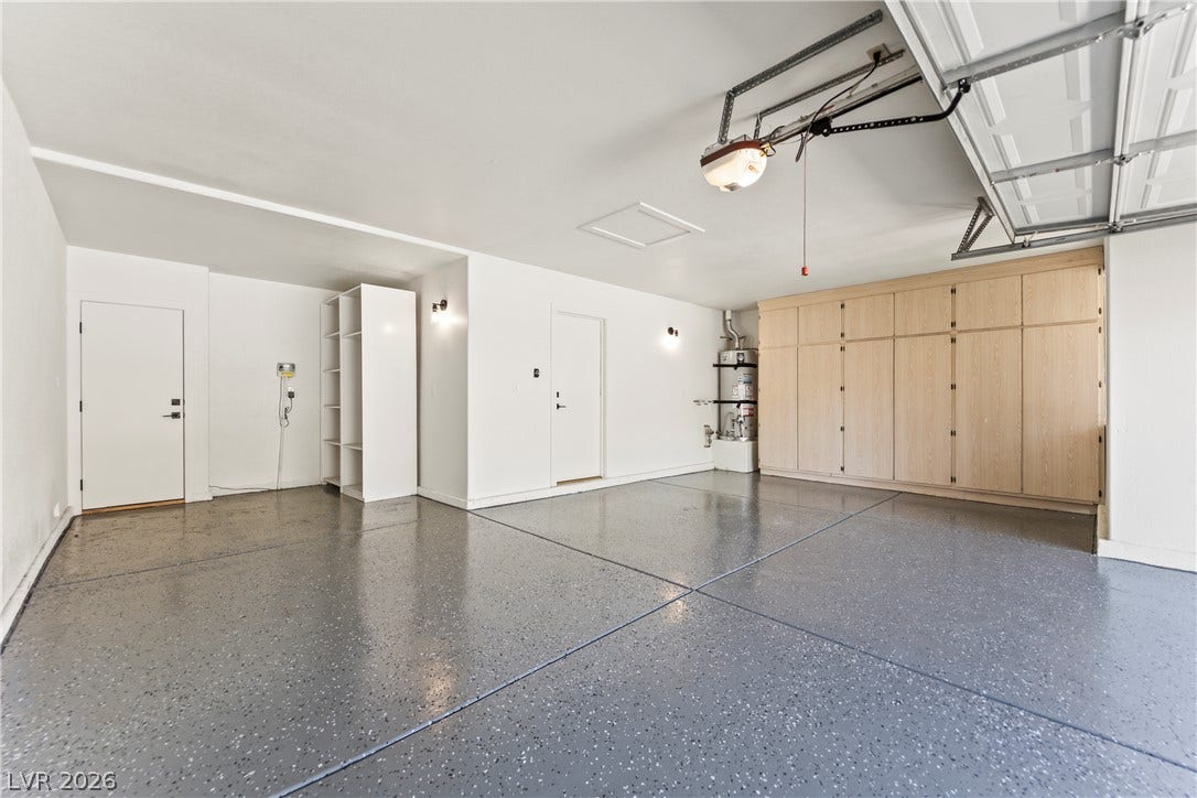 8921 Diamond Falls Drive, Las Vegas, NV 89117 A well-maintained garage offers ample storage solutions and a durable, easy-to-clean floor.