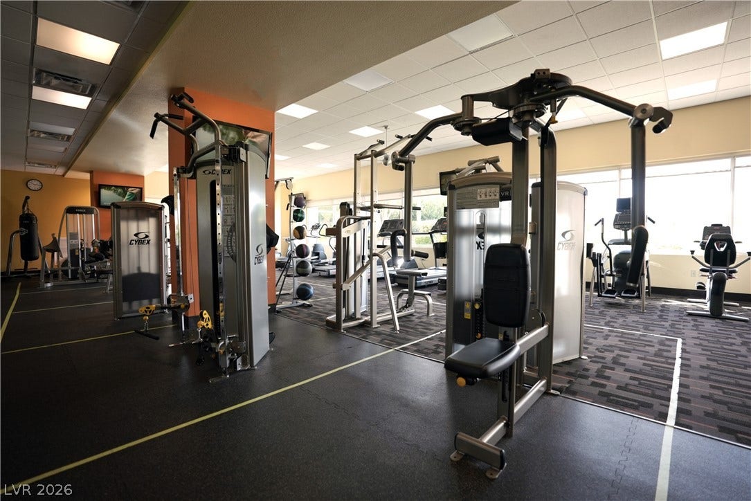 8921 Diamond Falls Drive, Las Vegas, NV 89117 Maintain your fitness goals in this generously proportioned gym, complete with various exercise equipment and naturally illuminated by expansive windows.
