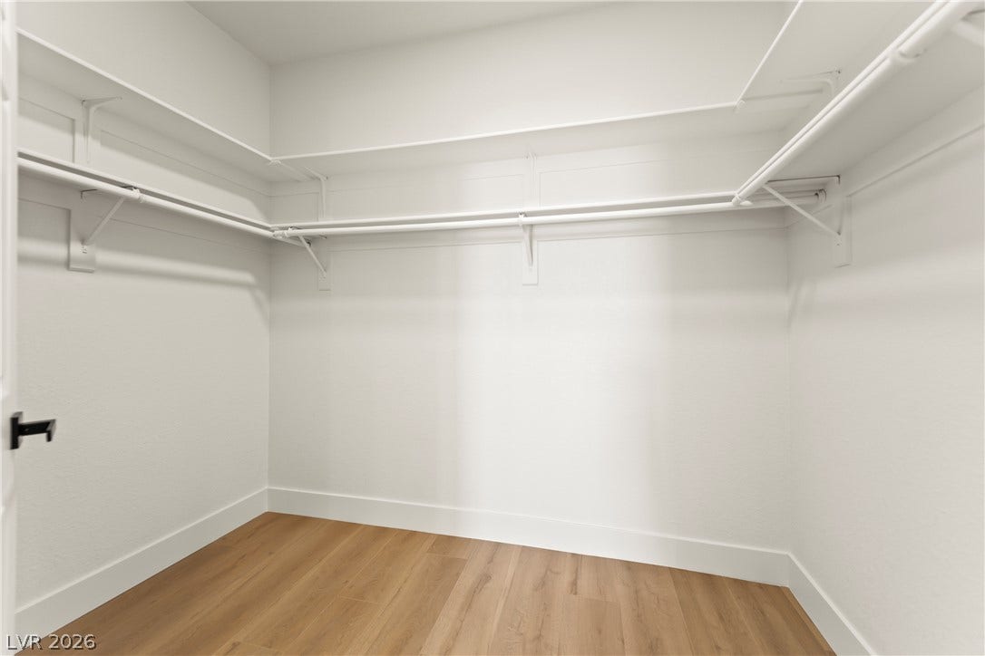 8921 Diamond Falls Drive, Las Vegas, NV 89117 Ample shelving and hanging space defines this practical closet, offering generous storage.