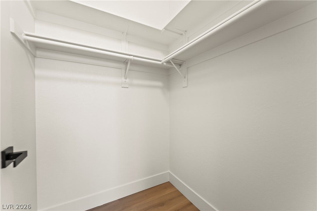 8921 Diamond Falls Drive, Las Vegas, NV 89117 Ample shelving and hanging space defines this thoughtfully organized walk-in closet.